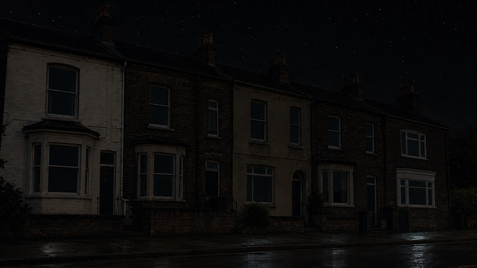 A row of terraces at night